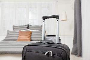 A close-up of a suitcase in a hotel